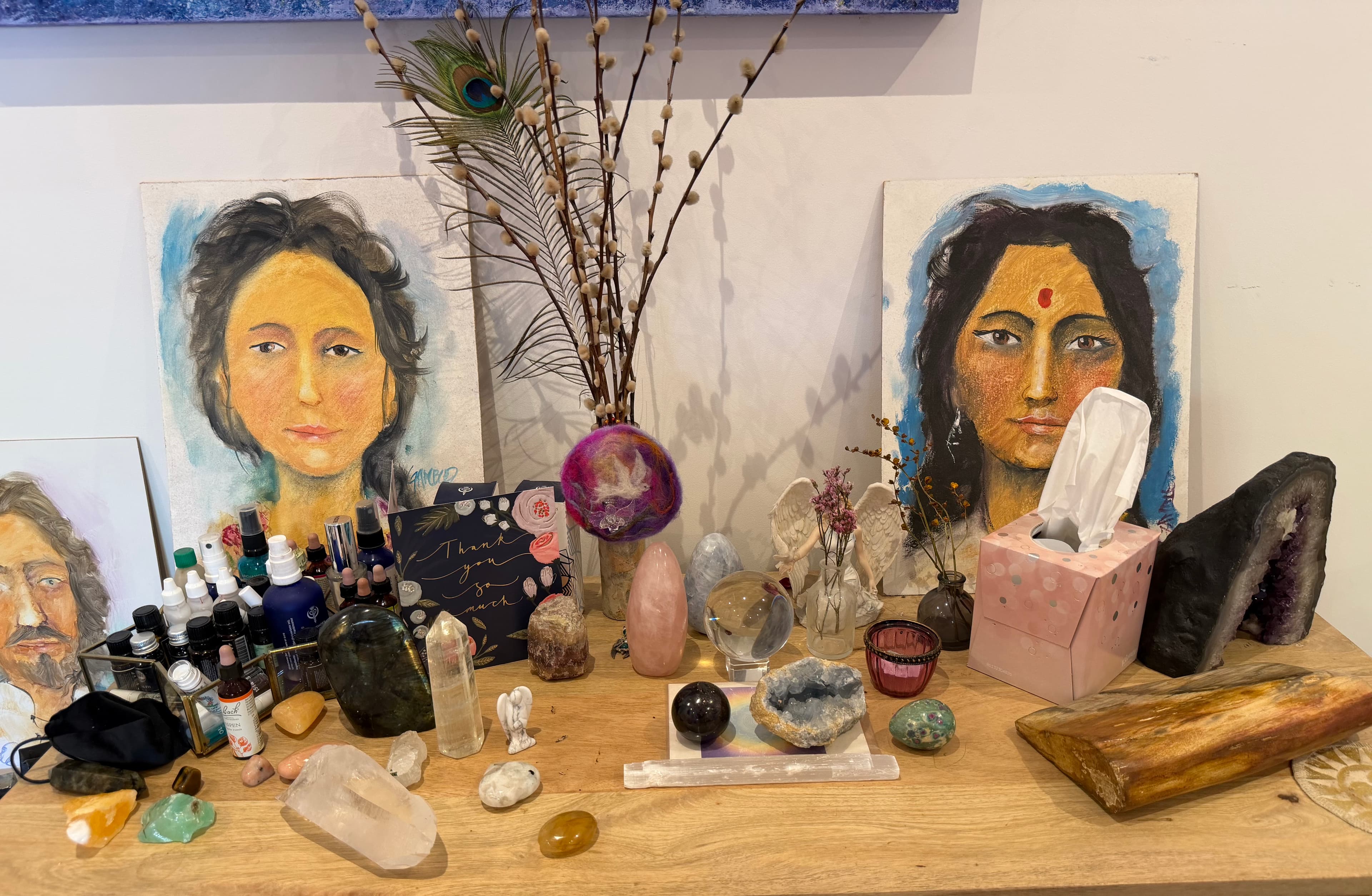 Rachel's healing altar with crystals, angelic paintings and sacred tools